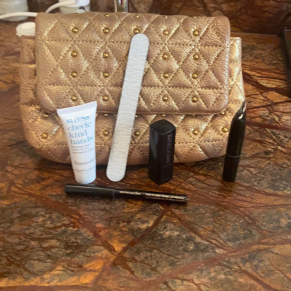 Little gold clutch with  lipstick